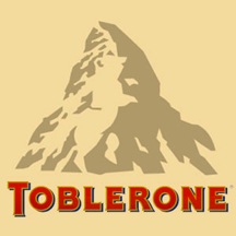 There is a dancing bear above the "BLE". Toblerone chocolate bars originated in Berne , Switzerland , whose symbol is the bear. It features the animal on its flag and coat-of-arms.